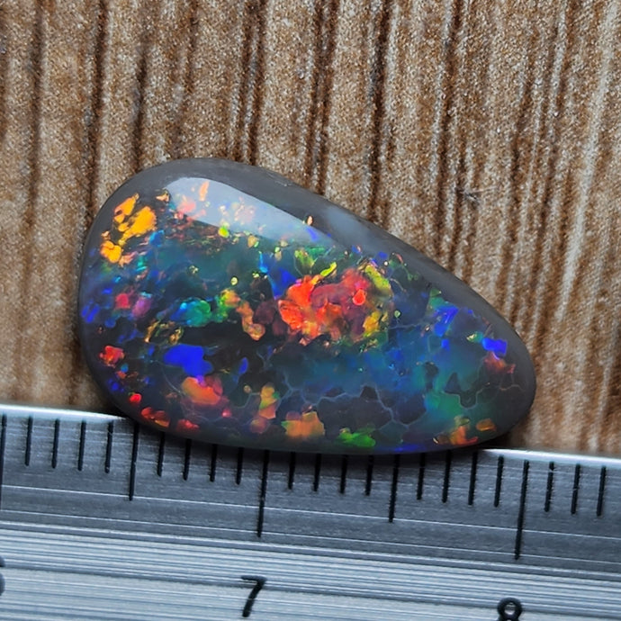 5.68 INCREDIBLE FIRE AND PATTERN BLACK OPAL GEM